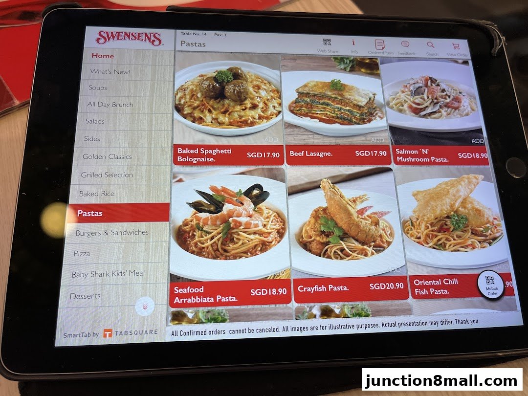 A tablet displaying the Swensen's menu with various pasta dishes and prices.