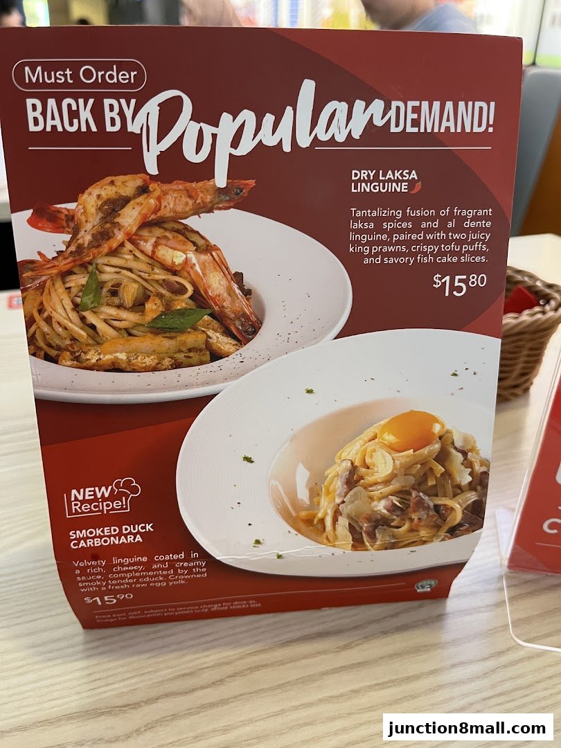 A menu board showcasing two popular pasta dishes from Swensen's.