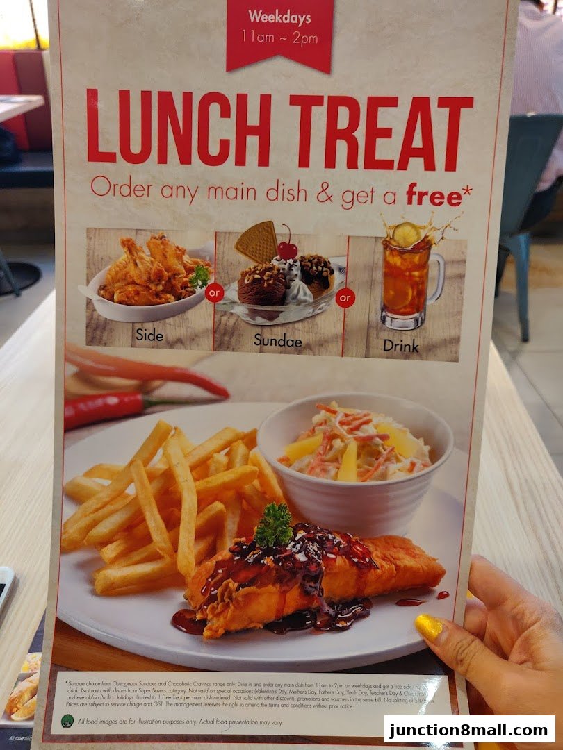 A menu offering a lunch treat with a free side, sundae, or drink with any main dish.