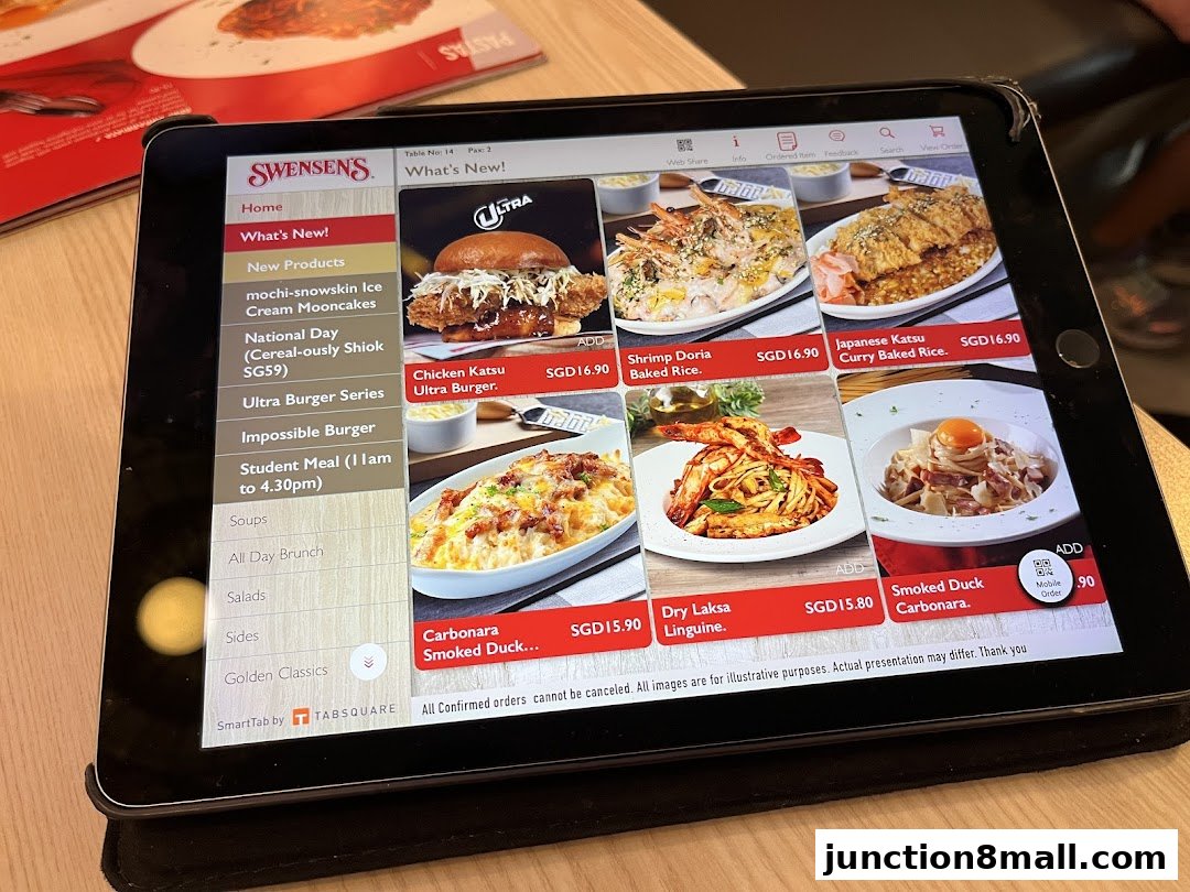 A tablet displays the Swensen's menu with various food items and prices.