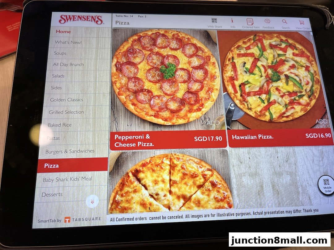 A tablet displaying the Swensen's menu with pizza options and prices.
