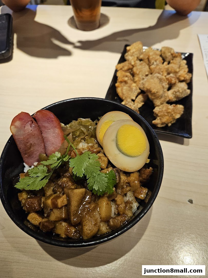A bowl of Taiwanese braised pork rice with a side of fried chicken.