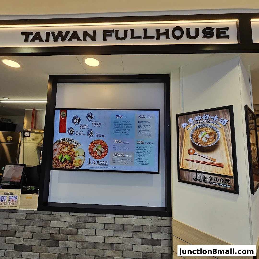 A digital menu board displaying Taiwanese food items and beverages.