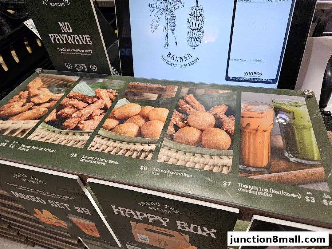 A display of Thai snacks and drinks with prices and descriptions.