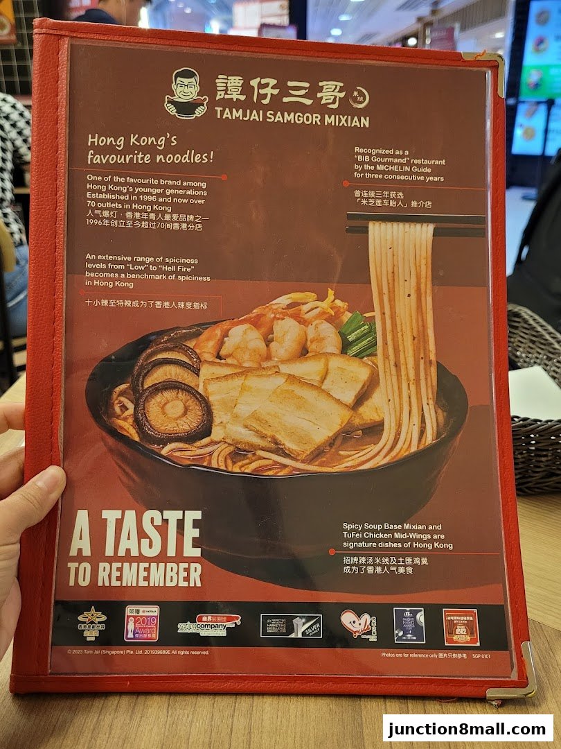 A menu from TamJai SamGor Mixian featuring a bowl of noodles and information about the brand.