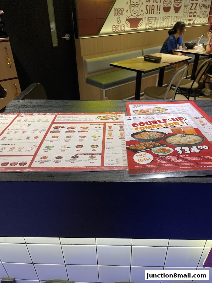 A close-up view of a menu from TamJai SamGor Mixian, showcasing various dishes and combo deals.