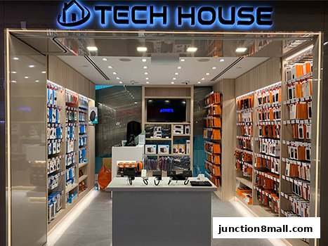 A well-lit electronics store showcasing a wide variety of phone accessories and gadgets.