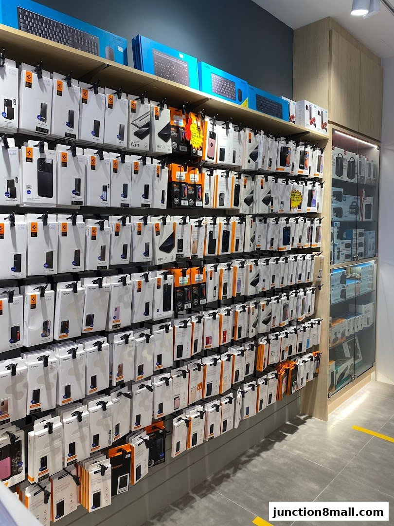 A wall display of phone cases and computer accessories in a retail store.