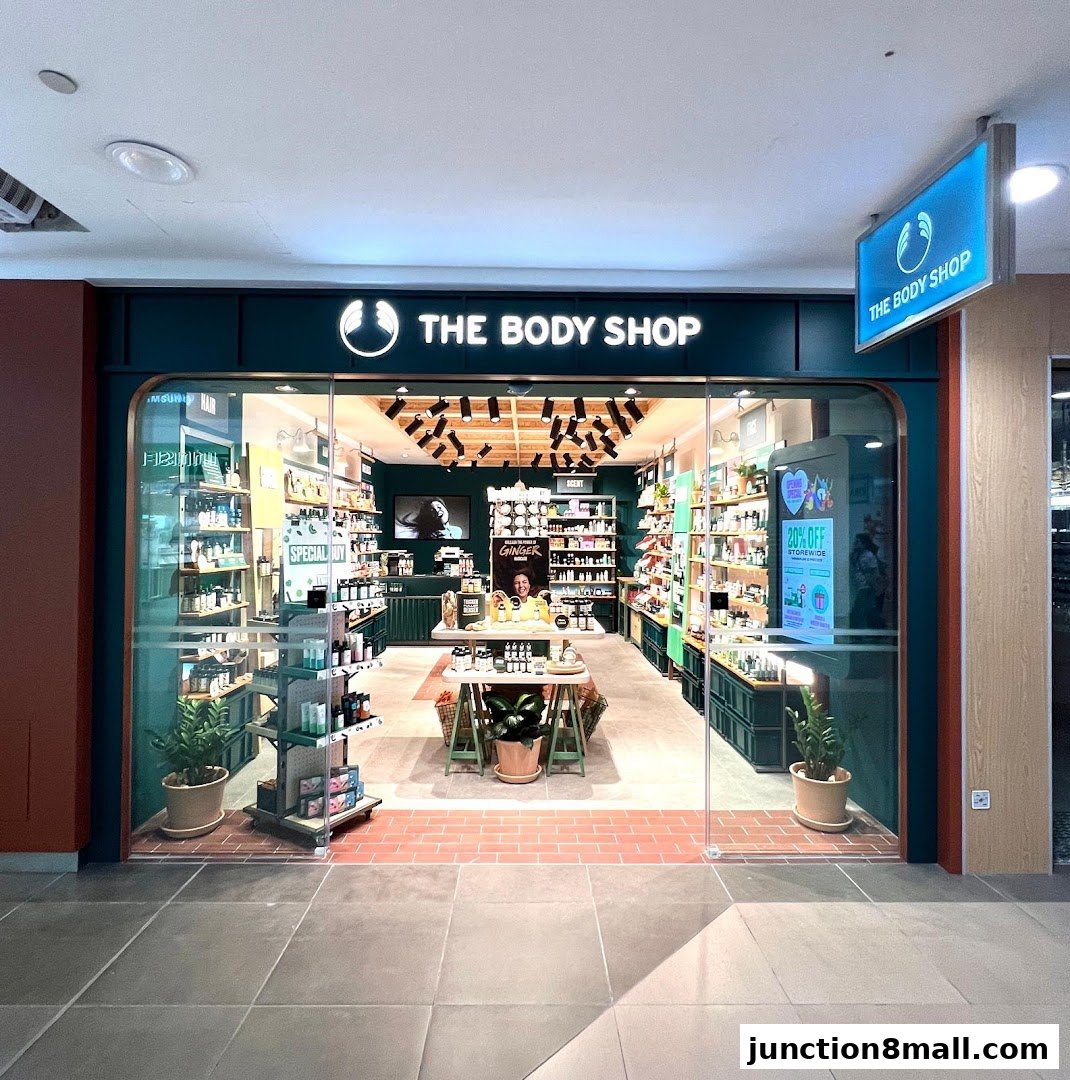 The Body Shop storefront with products displayed inside and a 20% off sign.