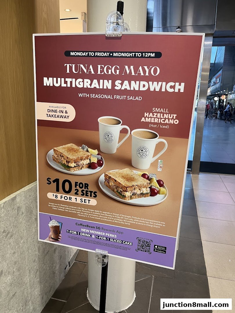 A promotional sign for The Coffee Bean and Tea Leaf featuring a sandwich and coffee deal.