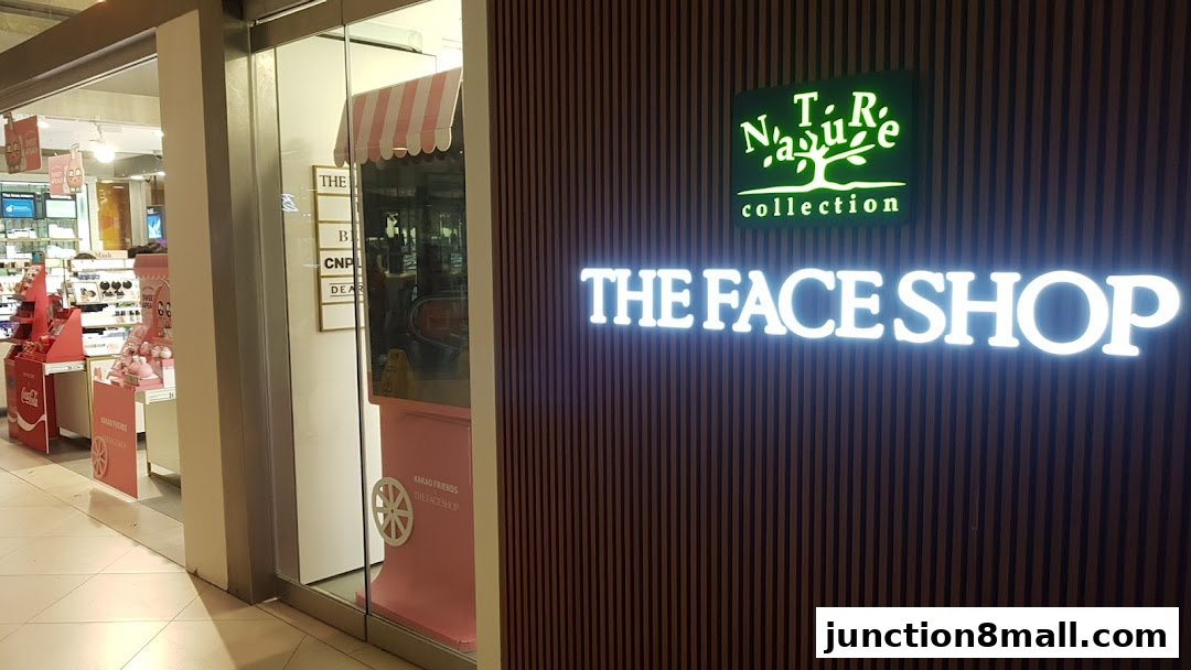 The exterior of THEFACESHOP - Nature Collection Junction 8, featuring its illuminated logo and storefront.