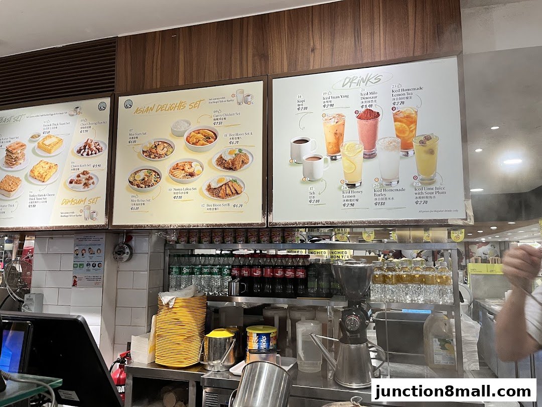 A menu board displaying various Asian delights, toast sets, dim sum, and drinks with prices.