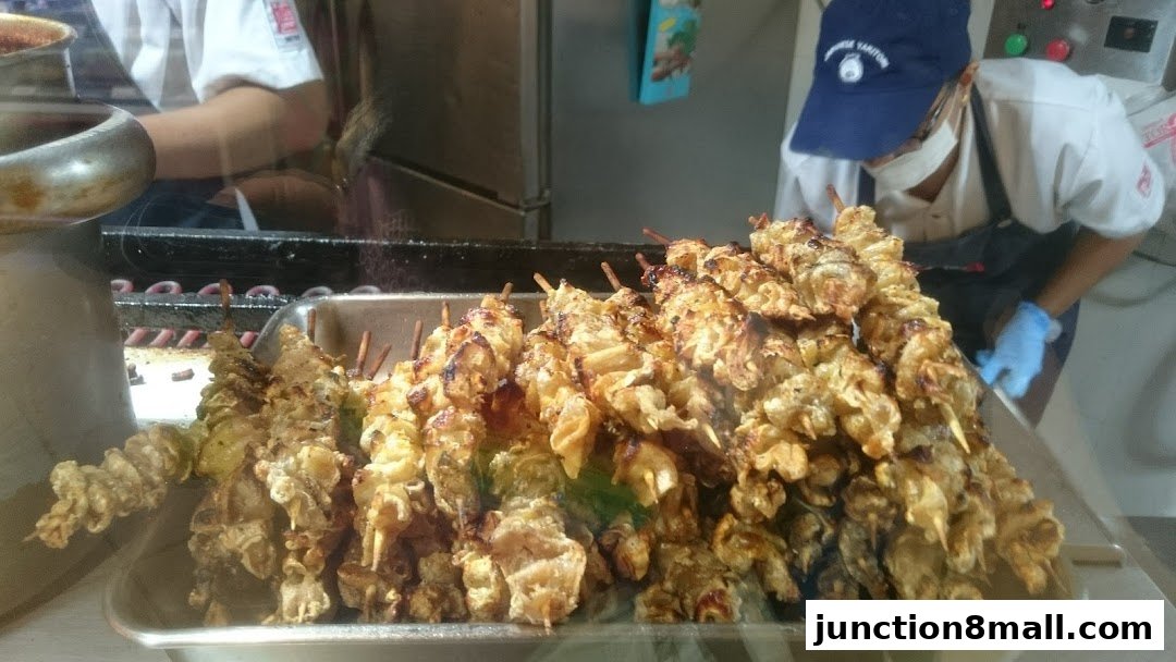 A close-up of freshly grilled skewers of chicken at Tori-Q Junction 8.
