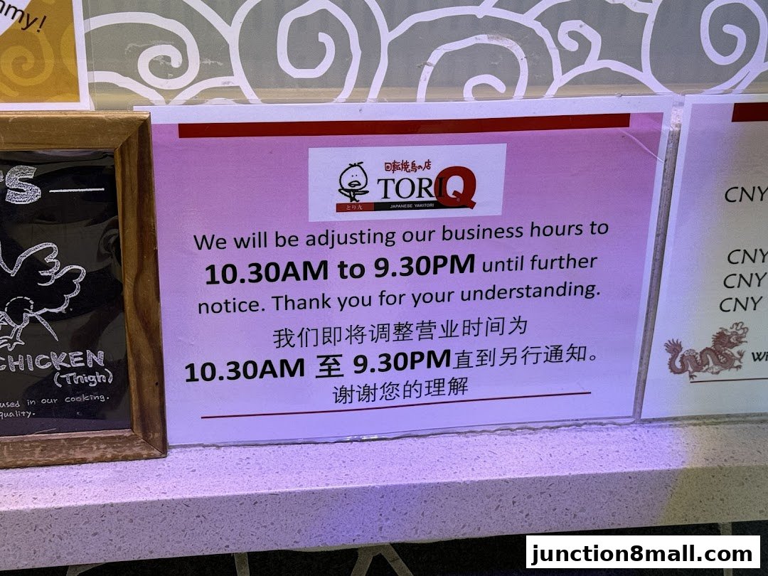 A sign announcing adjusted business hours for Tori-Q Japanese Yakitori.