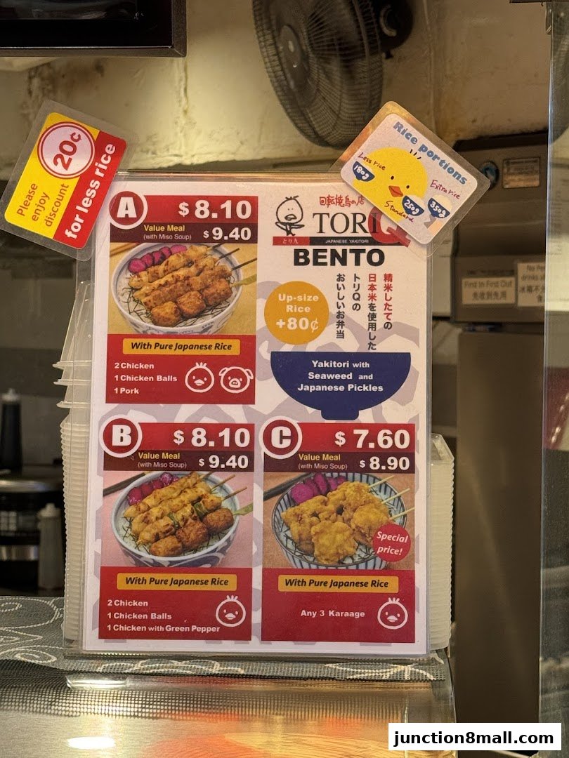 A menu board for Tori-Q Japanese Yakitori Bento with various meal options and prices.