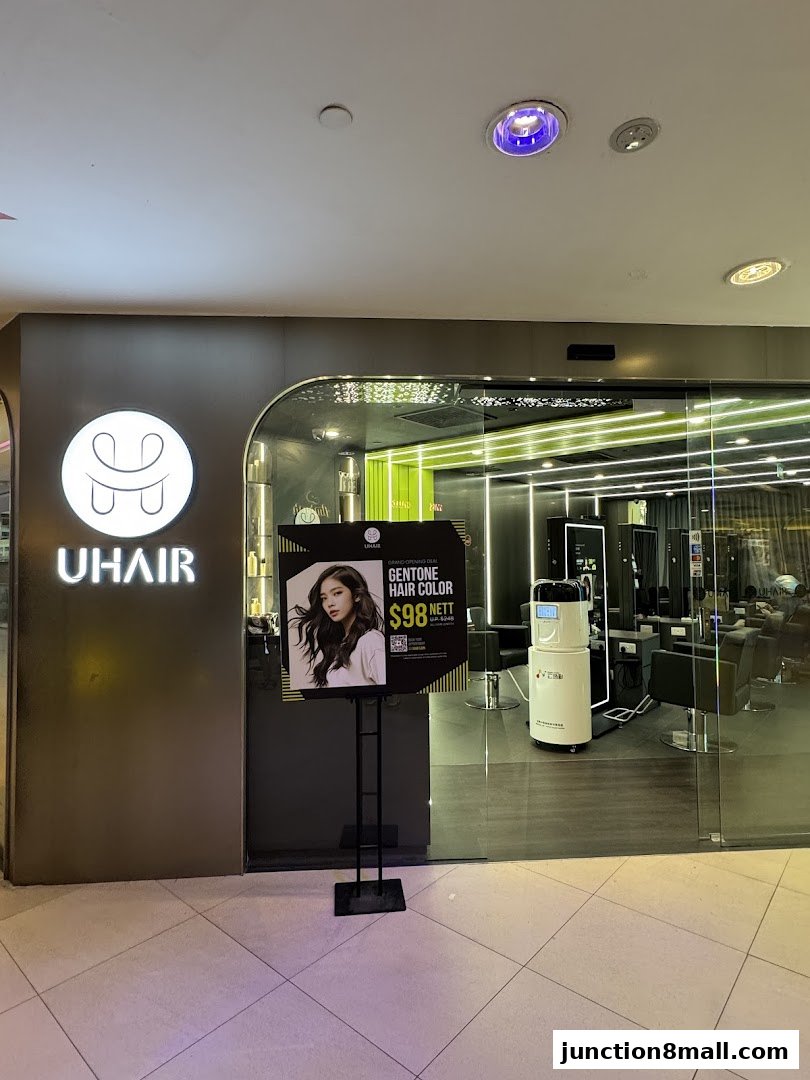 The exterior of U Hair Bishan salon, featuring a promotional poster for hair color.