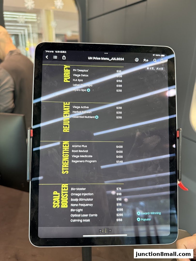 A tablet displaying the UH Price Menu for July 2024, categorized into Purify, Rejuvenate, Strengthen, and Scalp Booster.