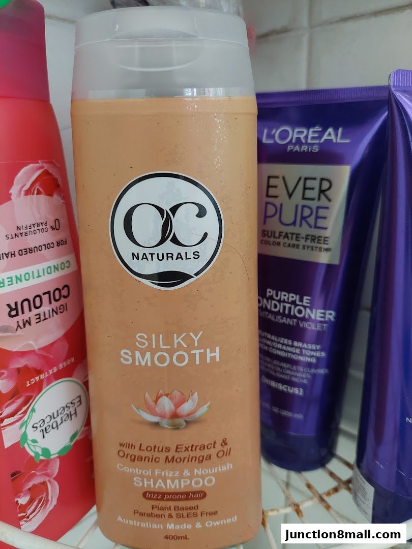 A close-up shot of several hair care products, including shampoos and conditioners.