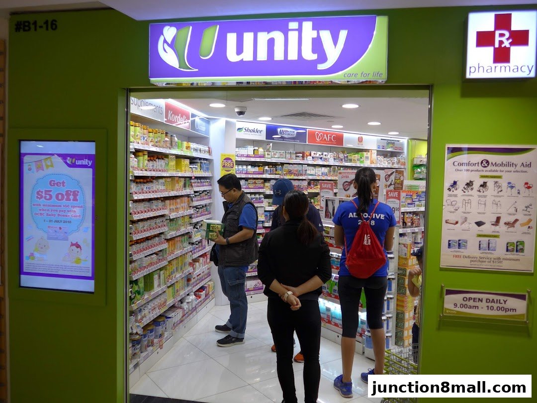 The entrance of a Unity pharmacy with shelves stocked with health and beauty products.