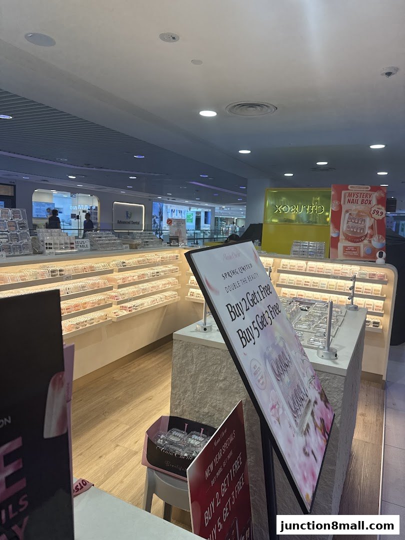 A nail salon display with various nail products and promotional signs.