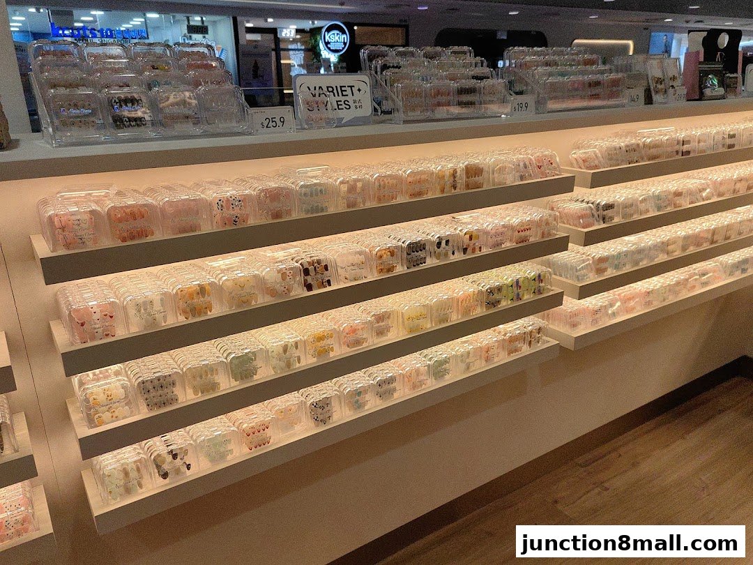 A display of various packaged nail art and accessories on shelves, with prices visible.