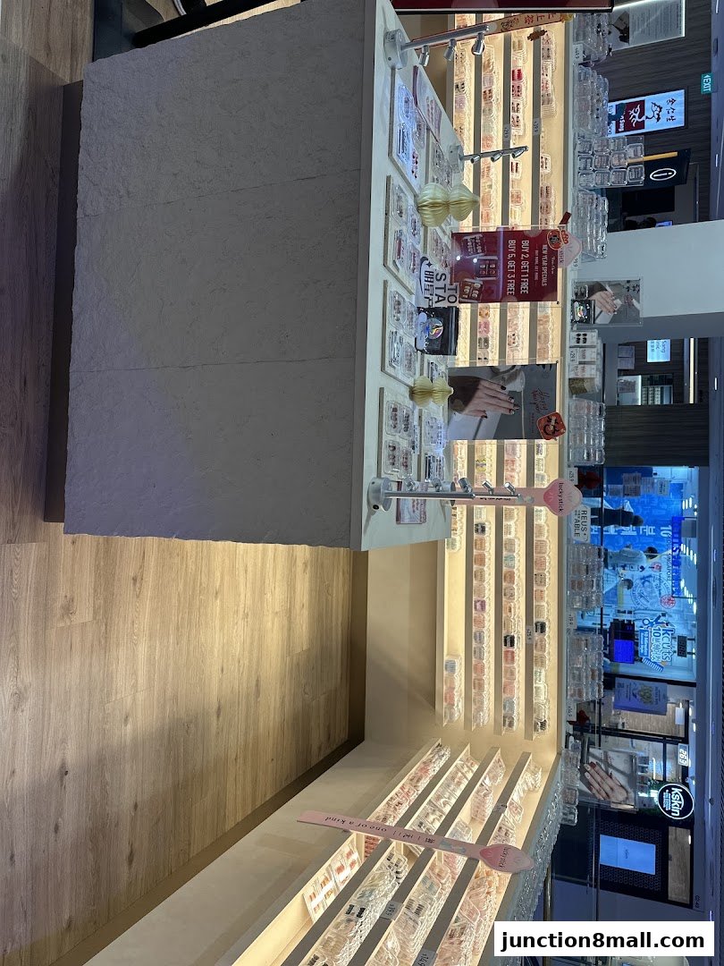 A retail shop display featuring various beauty products, likely nail art or accessories.