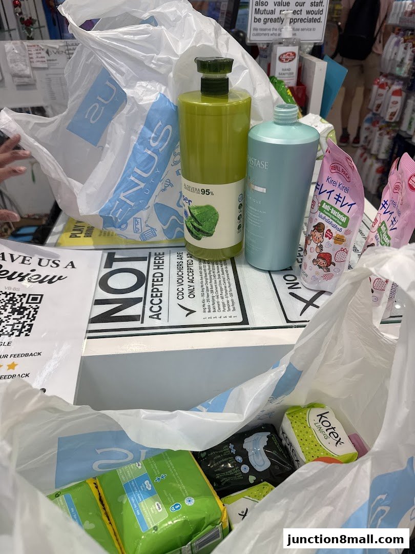 A shopping bag filled with beauty and personal care products from Venus Beauty Junction 8.