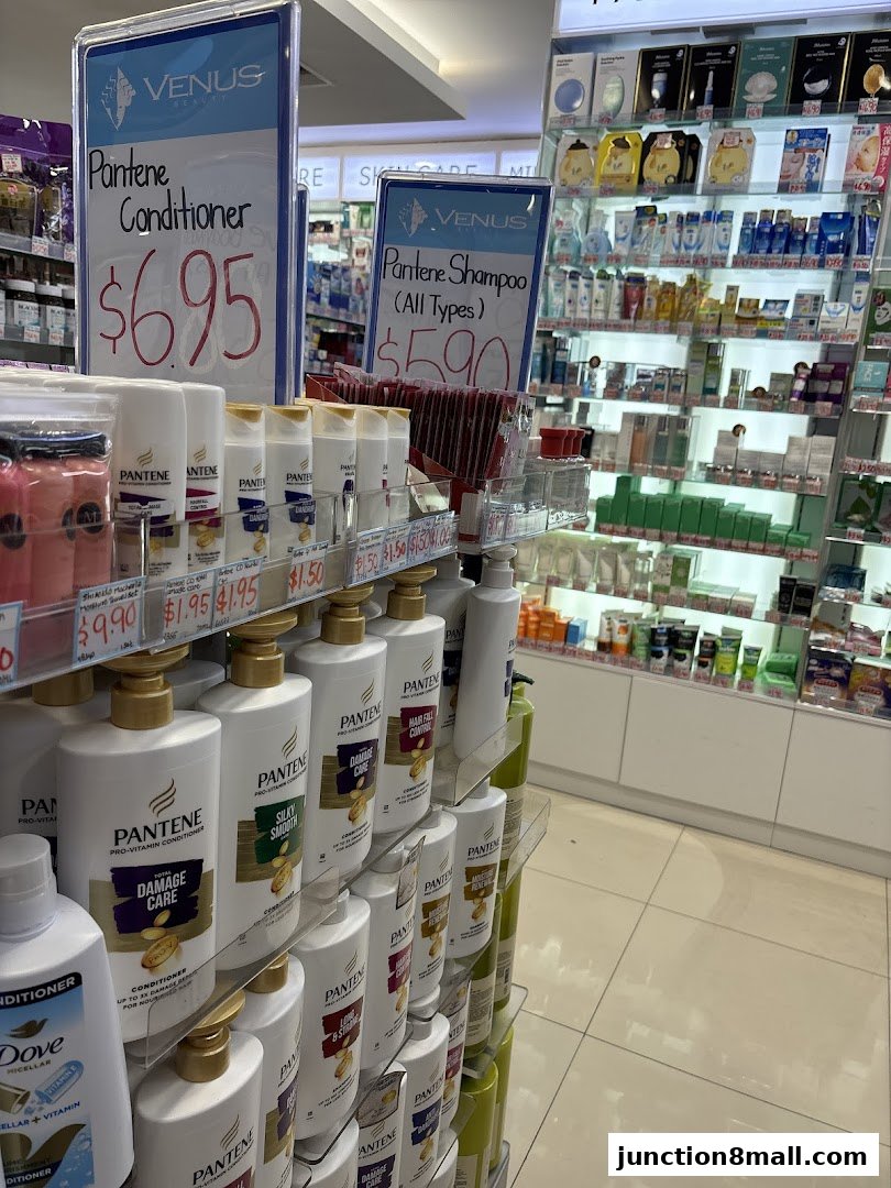 A display of Pantene shampoo and conditioner products with prices at Venus Beauty.