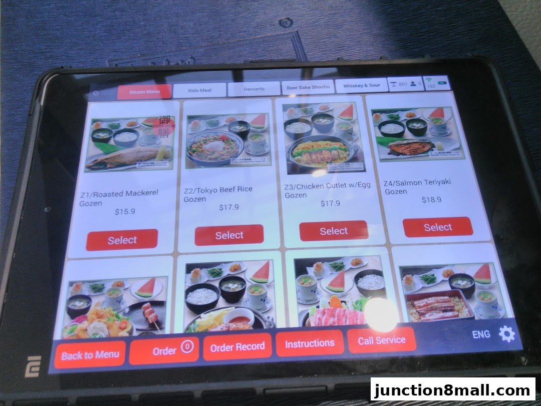A tablet displaying a digital menu for Japanese Gozen meals with images and prices.