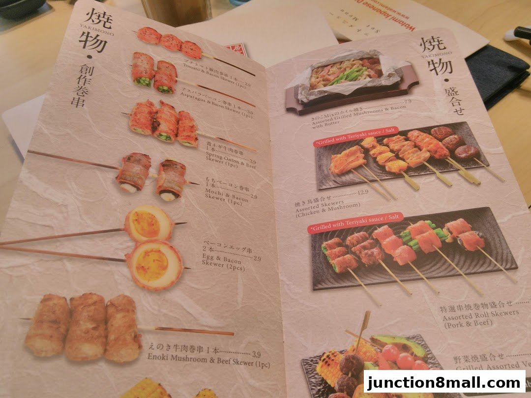 A menu from Watami Japanese Dining featuring various yakimono skewers and assorted dishes.