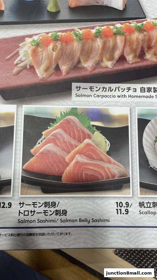 A menu featuring salmon carpaccio and salmon sashimi with prices.