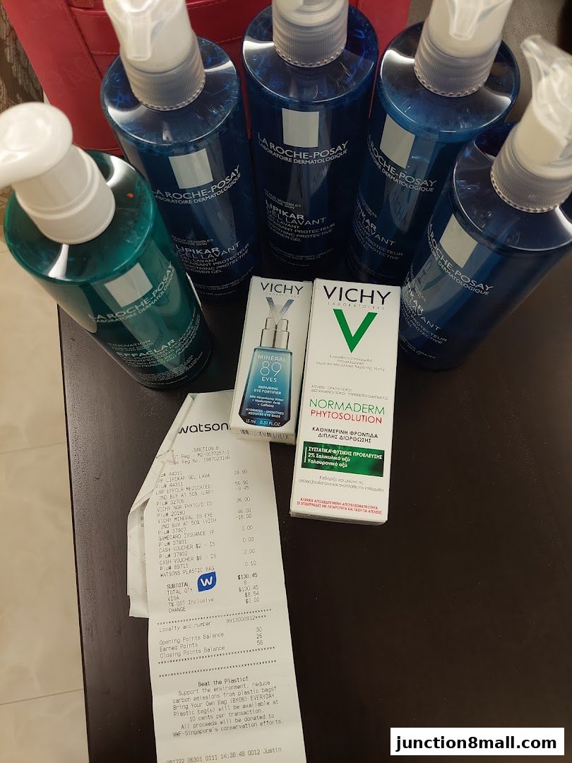 A collection of La Roche-Posay and Vichy skincare products with a Watsons receipt.