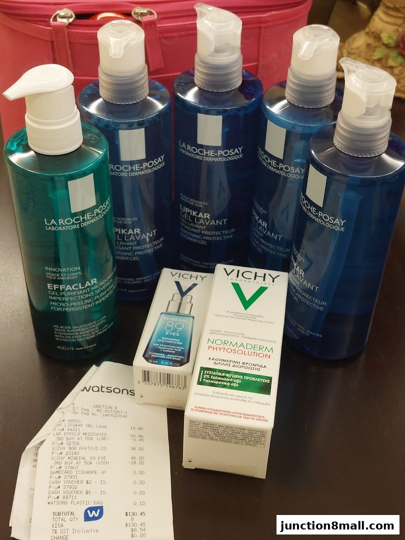 A collection of La Roche-Posay and Vichy skincare products with a Watsons receipt.