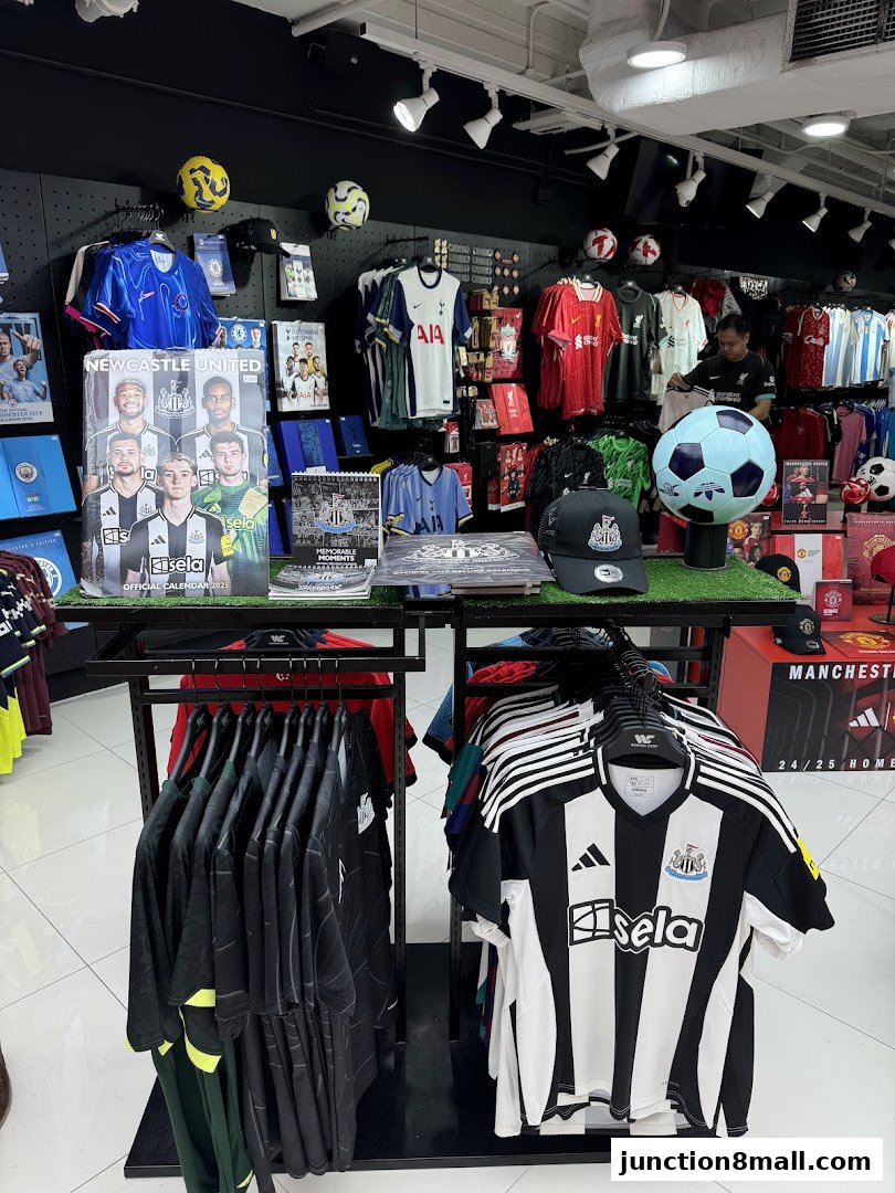 A retail shop displaying various football team jerseys, merchandise, and accessories.