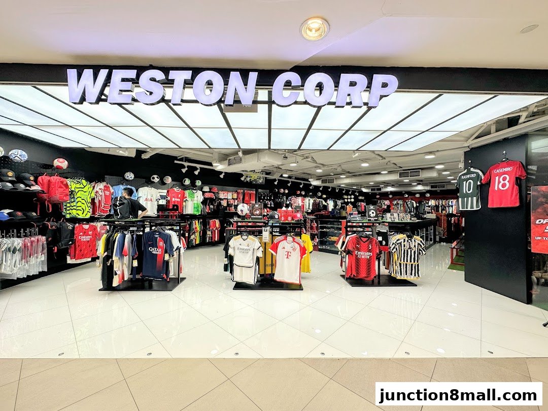 The entrance of Weston Corp, a sports apparel store, showcasing a wide selection of football jerseys and merchandise.
