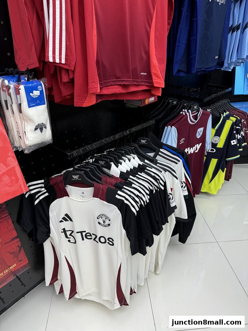 A display of various football jerseys and socks from different teams.