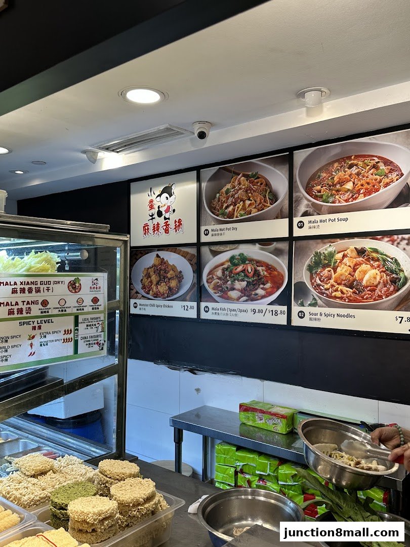 Interior view of a Mala Hot Pot restaurant with menu displays and ingredients.