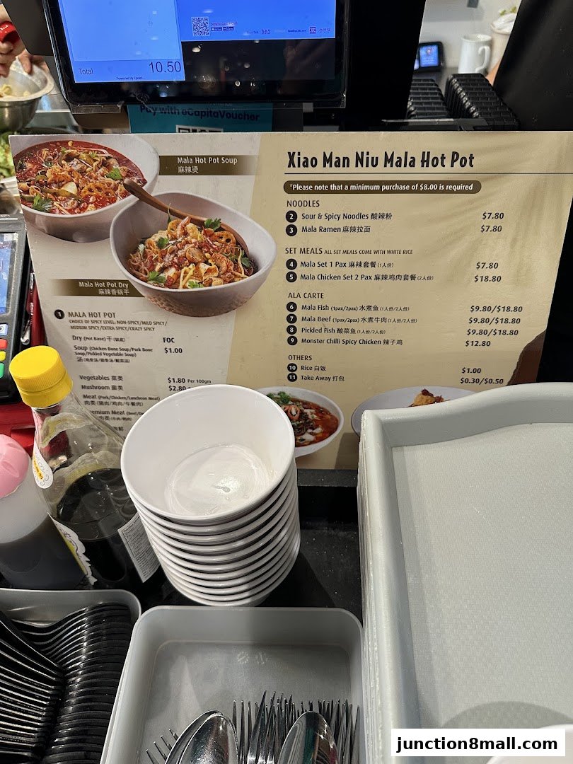 A menu for Xiao Man Niu Mala Hot Pot featuring various noodle and set meal options.