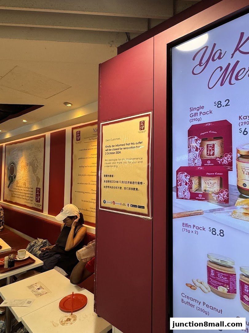 A notice of renovation is displayed at Ya Kun Kaya Toast, with some menu items visible on a digital screen.