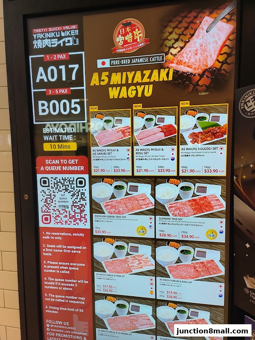 A digital menu board displaying various A5 Miyazaki Wagyu sets with prices and descriptions.