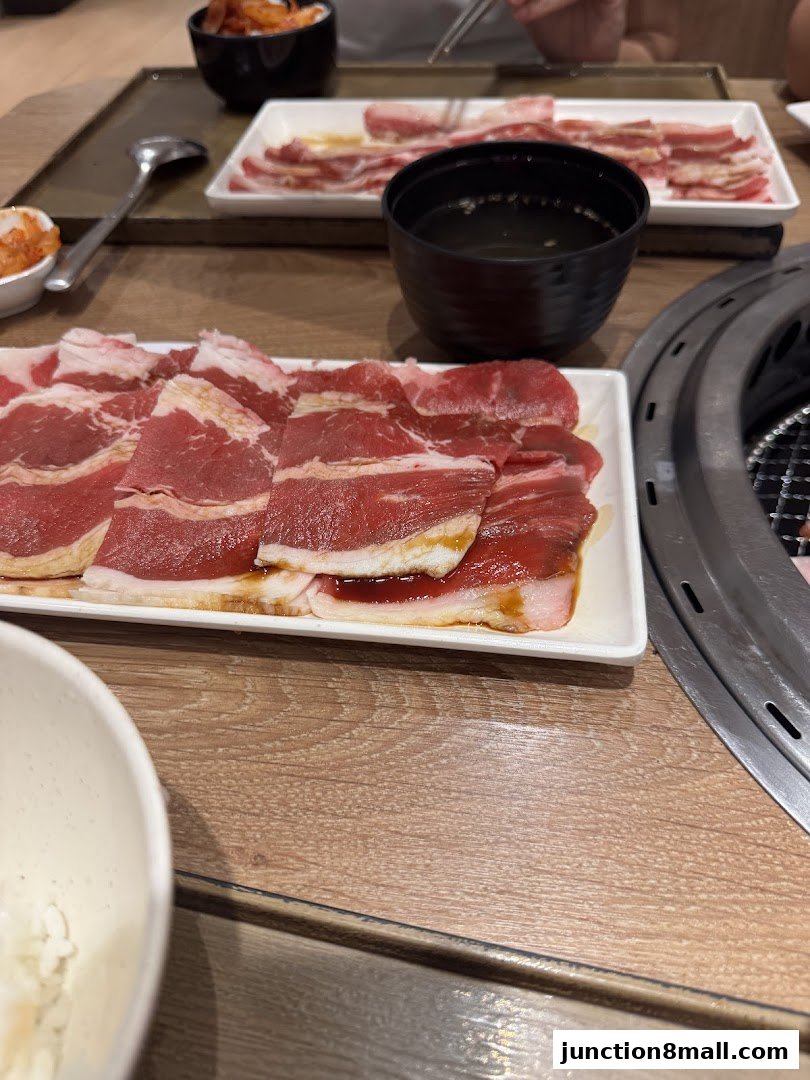 Slices of raw beef and kimchi are served at a Yakiniku Like restaurant.