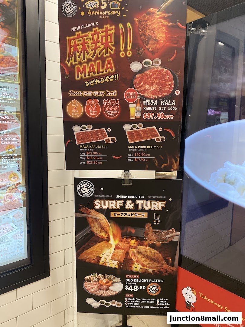 A menu board showcasing Yakiniku Like's Mala and Surf & Turf offerings.