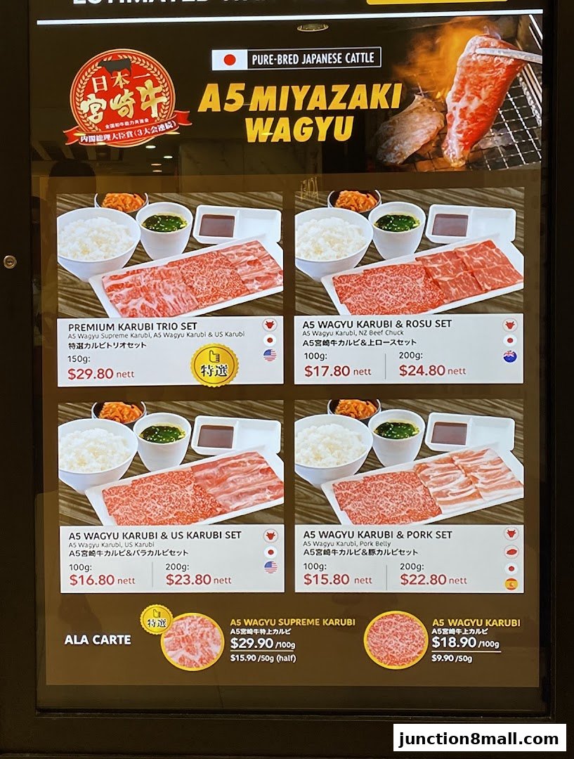 A menu display showcasing various sets and a la carte options of A5 Miyazaki Wagyu beef.