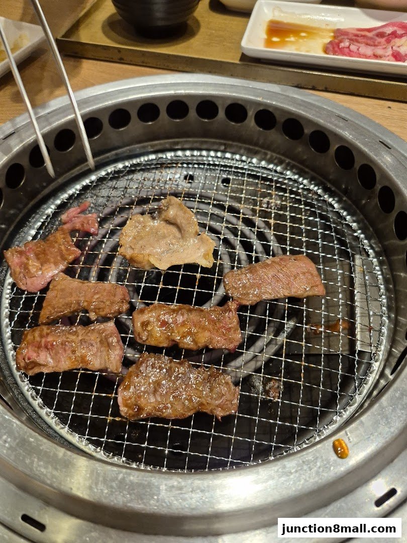 Sizzling cuts of beef are grilled to perfection on a yakiniku grill.