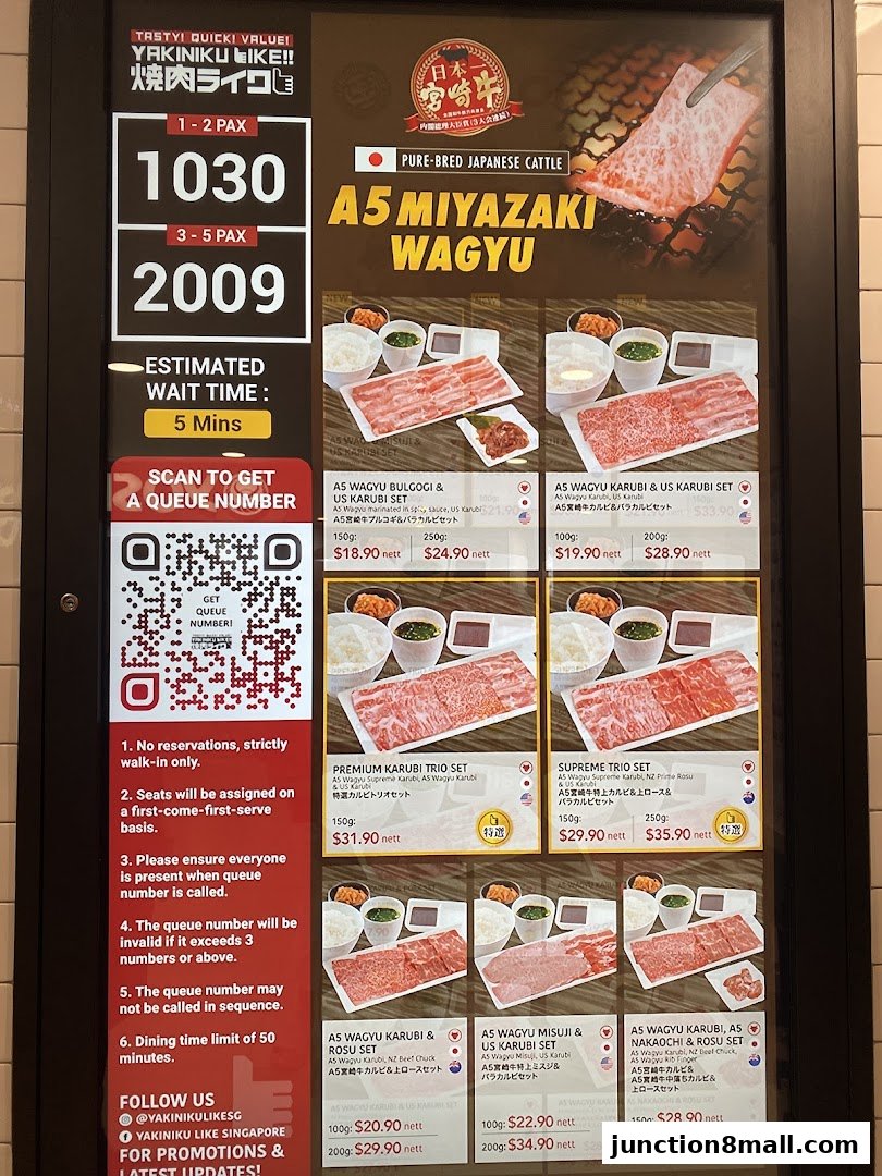 A menu board displaying various A5 Miyazaki Wagyu beef sets with prices and descriptions.