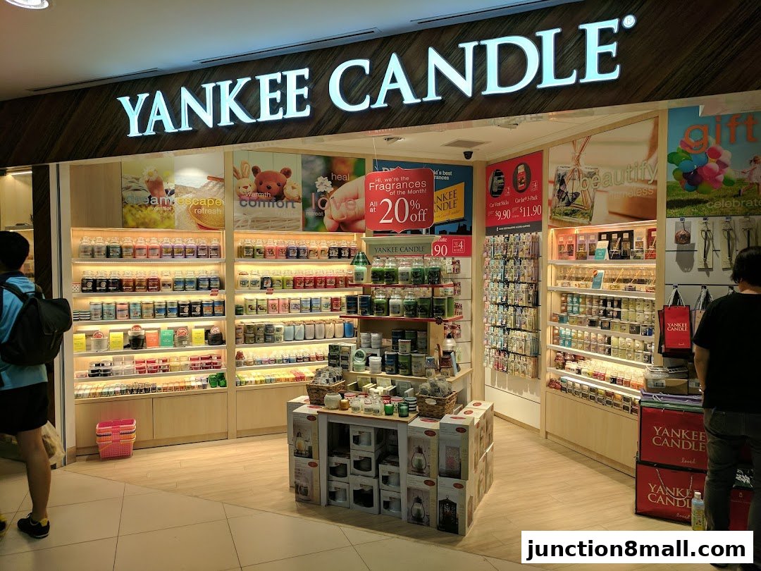 The interior of a Yankee Candle shop showcasing shelves filled with various scented candles and home fragrance products.