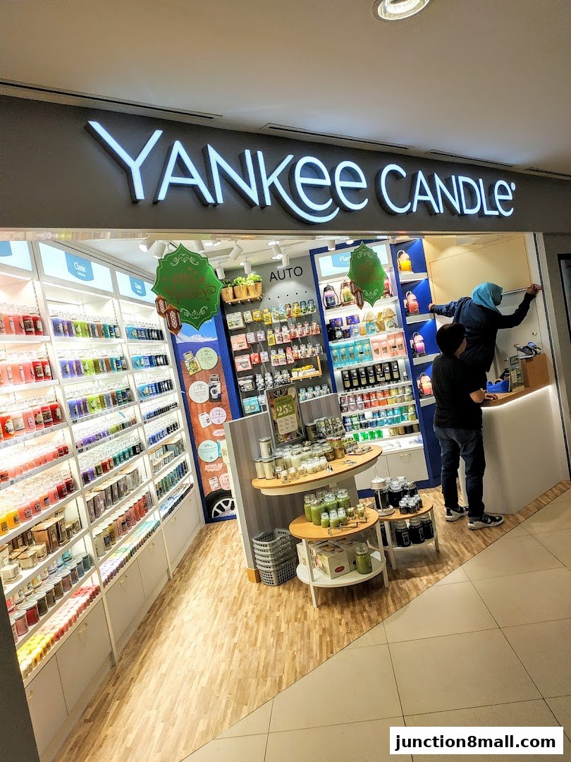 A Yankee Candle store interior showcasing a wide selection of scented candles and home fragrance products.