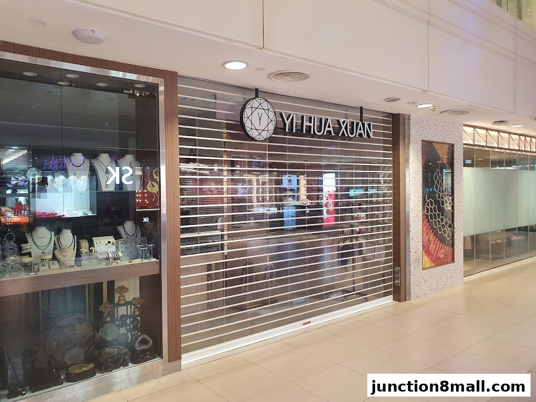 The Yi Hua Xuan shop front with its security shutters down, displaying jewelry in the window.