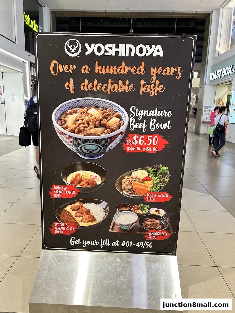 A Yoshinoya menu board showcasing various Japanese dishes and their prices.