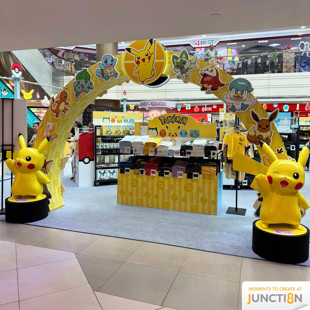 Cuddly Pokémon plushies arranged neatly on shelves.